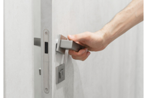 Male hand opens a secure door